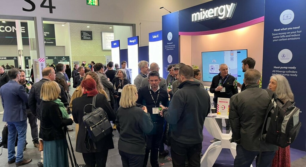 A crowd gathers around the Mixergy stand at the end of day 1